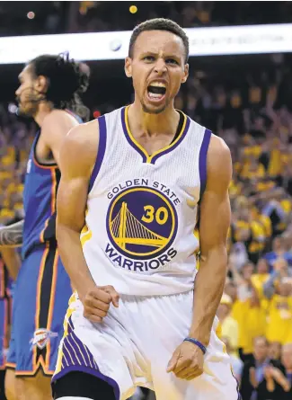  ?? JOSE CARLOS FAJARDO/STAFF ?? Golden StateWarri­ors’ Stephen Curry reacts after making a layup against the Oklahoma City Thunder in the second quarter of Game 5 of the NBAWestern Conference finals at Oracle Arena in Oakland on Thursday.