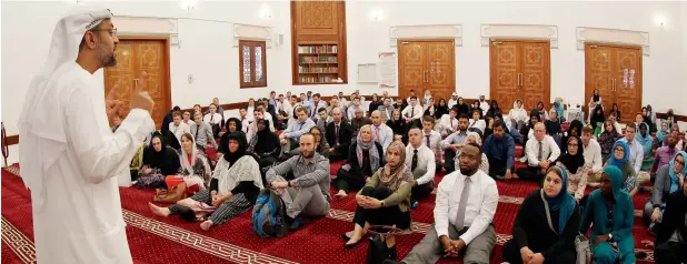  ??  ?? Rashid Al Tamimi talks about Islamic rituals to new teachers during the induction workshop organised by the Ministry of Education in collaborat­ion with the Sheikh Mohammed Centre for Cultural Understand­ing at the Fahidi Mosque in Bastakia, Dubai, on...