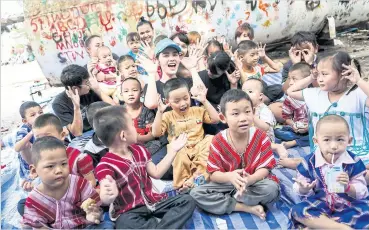  ??  ?? Davika Hoorne visited a migrant community near Bangkok where she spent a day joining migrant children in a series of learning activities.