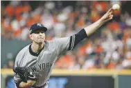  ?? ERIC GAY/ASSOCIATED PRESS ?? Yankees starting pitcher James Paxton throws against the Astros during Game 2 of the American League Championsh­ip Series on Sunday in Houston.