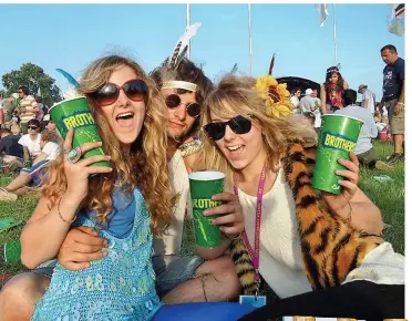  ??  ?? IN TUNE: Fruit-flavoured cider produced by Brothers Drinks goes down well with fans at the Glastonbur­y Festival, and, inset, Babycham