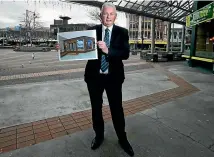  ??  ?? Venture Southland chief executive Paul Casson with a design of the new iSite building in Wachner Pl, where it will open in September. KAVINDA HERATH/STUFF