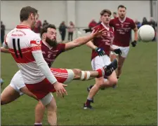  ??  ?? Matty Forde of Kilanerin gets his kick away despite the blocking attempt by Castletown’s Conor Carty.