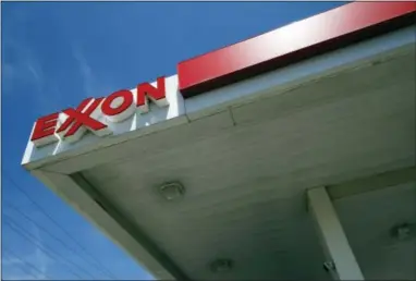  ?? THE ASSOCIATED PRESS ?? Exxon Mobil reported quarterly financial results on Friday. Exxon’s oil and gas production fell 4.7 percent in the third quarter from the same period a year ago. Its production of the equivalent of 3.83 million barrels of oil per day in the quarter was...