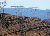  ?? Gary Coronado Los Angeles Times ?? POWER lines pass through Palmdale. Southern California Edison is seeking a $595.6-million rate hike.