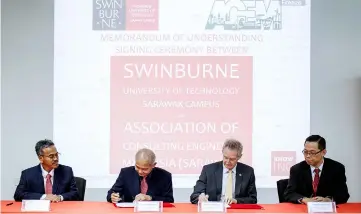  ??  ?? Chieng (second left) and Wilson (second right) sign the MoU witnessed by Lainus (left) and Su.