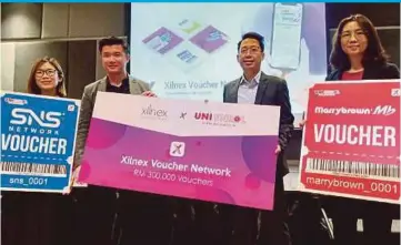  ?? ?? (From left) SNS Network Sdn Bhd retail manager Livia Tham, Web Bytes Sdn Bhd chief executive officer (CEO) Ooi Boon Sheng, Uni Enrol Sdn Bhd CEO Rickson Khaw and Marrybrown Sdn Bhd assistant branding manager Cherrie Yong at the launch of the Xilnex Voucher Network yesterday.