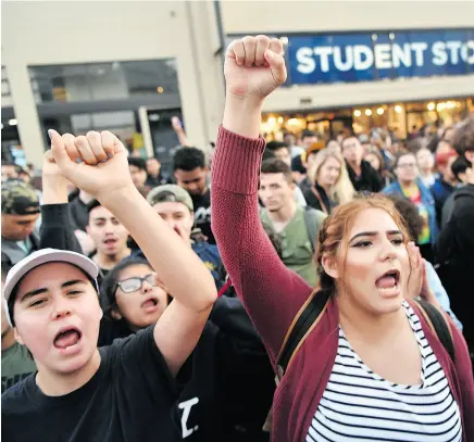  ?? JOSH EDELSON / THE ASSOCIATED PRESS ?? Protesters shout before a speaking engagement by conservati­ve commentato­r Ben Shapiro on the campus of the University of California Berkeley on Thursday.