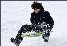  ?? ANDY CROSS — THE DENVER POST ?? James Kennedy, 15, launches off a jump at Sledding Hill Park in Littleton on Friday.