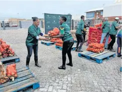  ?? ?? GIFT of the Givers volunteers prepare ingredient­s for their Ramadaan campaign to feed the hungry every night.