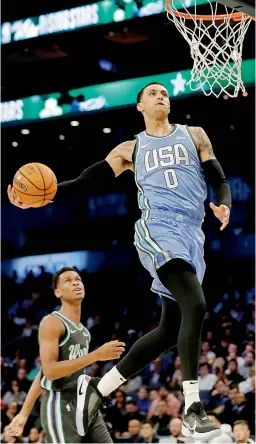  ?? — AP ?? Team USA’s Kyle Kuzma goes for a dunk against Team World during the NBA All-Star Rising Stars game on Friday in Charlotte.