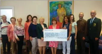  ??  ?? Members of Strandhill Golf Club and friends took part in Camino de Santiago in aid of Sligo Cancer Support Centre. They are pictured presenting cheque for € 8,028 to Maureen Durcan.