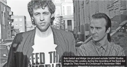  ?? ?? Bob Geldof and Midge Ure pictured outside SARM Studios in Notting Hill, London, during the recording of the Band Aid single Do They Know It’s Christmas? in November 1984