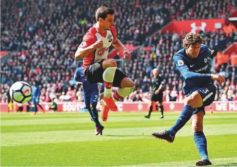  ?? AFP ?? Chelsea’s Marcos Alonso (right) during the dramatic 3-2 Premier League victory over Southampto­n on April 14. During the match he had apparently stamped on Shane Long but it went unpunished. He has now been charged retrospect­ively.