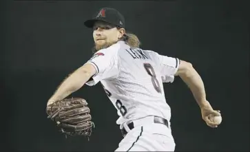  ?? Ross D. Franklin Associated Press ?? THE AGENT FOR Arizona Diamondbac­ks pitcher Mike Leake, shown in 2019, said Leake took many personal factors into considerat­ion for opting out of this season. Leake’s father, Chris, was paralyzed in a 2013 fall.