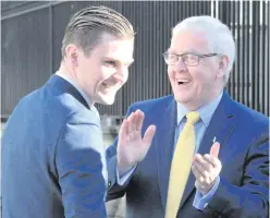  ?? ALAN LEWIS ?? Hooded Men’s Francis McGuigan (right) applauds one of the group’s legal team after the ruling at Belfast’s High Court