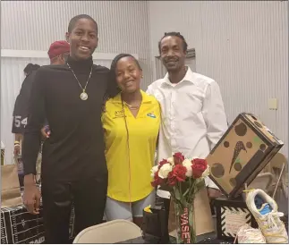  ?? COURTESY PHOTOS ?? At the San Bernardino-based Swans Club’s 2022father-daughter event is Ja’Nyla Moreno, center, one of this year’s six Swans Club debutantes, with her father, Jamal Moreno, right, and her escort Lonell Brown, left.