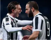  ?? AFP ?? Juventus forward Federico Bernardesc­hi ( left) celebrates with team mate Gonzalo Higuain after scoring against Fiorentina in their Italian League match at the Atemio Franchi Stadium in Florence. —