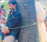  ?? HT PHOTO ?? The married woman and her lover are tied to tree in Bihar's Muzaffarpu­r district.