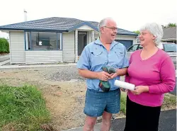  ?? STUFF ?? David and Georgina Hilston in 2013 outside their four-bedroom home on Harvey St, which had been transporte­d from the Christchur­ch red zone.