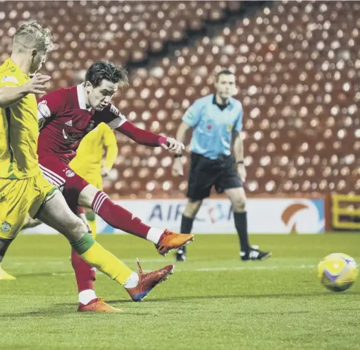  ??  ?? fifth- minute opener for Aberdeen against Hibs at Pittodrie last night.