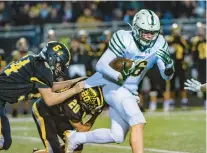  ?? APRIL GAMIZ/THE MORNING CALL ?? Allentown Central Catholic’s Caiden Shaffer, right, runs the ball against Northweste­rn Lehigh during a Nov. 12 District 11 Class 4A championsh­ip game.