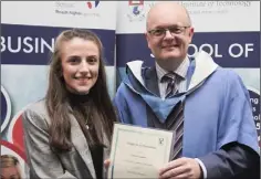  ??  ?? Aideen Cummins receiving her Dean’s List certificat­e from Dr Thomas O’Toole.