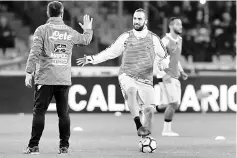  ??  ?? Juventus’ Gonzalo Higuain warms up before the Italian Serie A match against Napoli at the San Paolo stadium in Naples in this Dec 1 file photo. — AFP photo