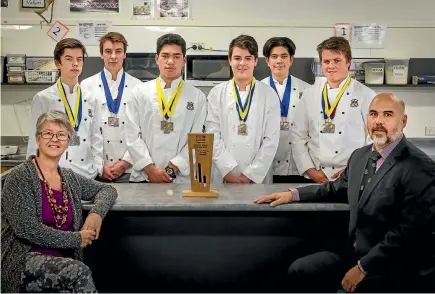  ?? PHOTOS: GRANT MATTHEW/STUFF ?? New Plymouth Boys’ High School had some success at a national cooking competitio­n in Auckland recently. (Back) Ethan Corry, left, Zackery Schwass, John Lea, Brayden Thompson, Toby Rameua, Connor Yardley. (Front) Mrs Adrienne Roberts, Mr Aaron Lock.