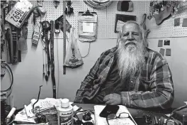  ?? GRANT SCHULTE/AP ?? Danny Rice, shown at his auto repair shop Nov. 9 in Elmwood, Nebraska, isn’t particular­ly concerned if he contracts the coronaviru­s. “If I get it, I get it,” the 67-year-old said.