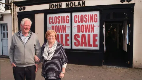  ??  ?? John and Irene Nolan outside their premises on Main Street, Gorey.