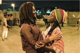  ?? CHIABELLA JAMES/PARAMOUNT PICTURES VÍA AP ?? Kingsley Ben-Adir as reggae superstar Bob Marley with Lashana Lynch in “Bob Marley: One Love.”