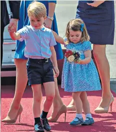  ??  ?? Well turned-out: Prince George and Princess Charlotte arrive in Berlin