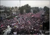  ?? THE ASSOCIATED PRESS ?? Followers of Shiite cleric Muqtada al-Sadr gather in Baghdad, Iraq, Friday.