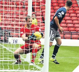  ??  ?? ■ Queen’s Park thought they had scored a third goal but the referee ruled Morton keeper Andy McNeil prevented the ball crossing the line.