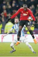  ?? — Reuters ?? Manchester United’s Romelu Lukaku in action with Huddersfie­ld Town’s Scott Malone.