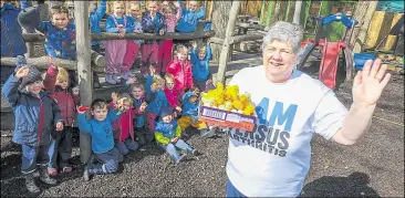  ?? Ref: 14-0322A ?? Renate Hughes with the Cold Ash Pre-school children and around 40 crocheted chicks