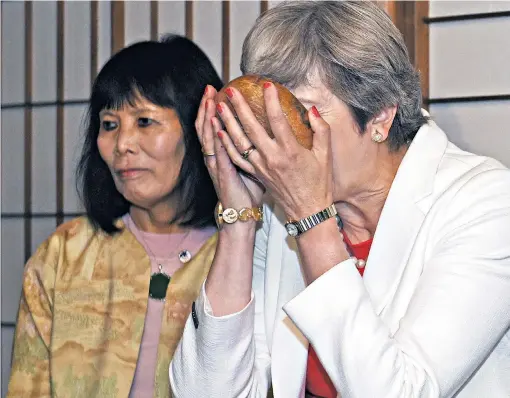  ??  ?? Brewing up Tory resentment?: Mrs May takes part in a tea ceremony in Kyoto yesterday during her visit to Japan