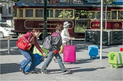  ?? PHOTO: DAVID WALKER/STUFF ?? New Zealand and internatio­nal tourists paid $3.3 billion in GST last year.