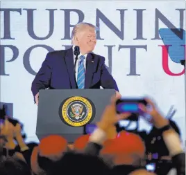  ?? Andrew Harnik The Associated Press ?? President Donald Trump soaks up support from a conservati­ve audience at Turning Point USA’S teen summit on Tuesday in Washington.