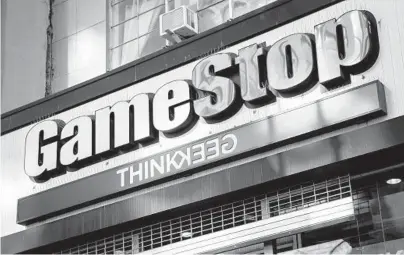  ?? JOHN MINCHILLO/AP ?? Shares in retailer GameStop shot up more than 1,600% in January thanks to a new generation of online traders who band together on social media to champion the same stocks. However, the majority of retirement savers are sticking with their savings plans.