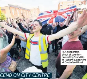  ??  ?? FLA supporters shout at counterpro­testing Stand Up to Racism supporters at Castlefiel­d Bowl
