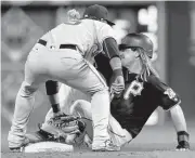  ?? KEITH SRAKOCIC/ASSOCIATED PRESS ?? Giants shortstop Brandon Crawford, left, tags out the Pirates’ John Jaso at second base for the final out Wednesday.