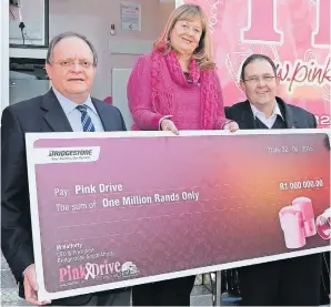  ??  ?? PROUD. Deputy Minister of Sport and Recreation Gert Oosthuizen, left,Noelene Kotschan, CEO and founder of PinkDrive, and Shaun Wustmann, divisional head of sales and marketing for Bridgeston­e SA.