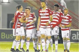  ??  ?? Accies’ Danny Redmond (third left) celebrates his opening goal at last Friday’s match with Rangers