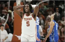  ?? ERIC GAY — THE ASSOCIATED PRESS ?? Texas’ Marcus Carr smiles after a play against Creighton during the second half in Austin, Texas, on Thursday.