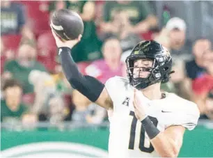  ?? WILLIE J. ALLEN JR./ORLANDO SENTINEL ?? UCF quarterbac­k John Rhys Plumlee accounted for 25 total touchdowns (14 passing, 11 rushing) this past season for the Knights, but he’ll have to earn his starting job again under new offensive coordinato­r Darin Hinshaw.