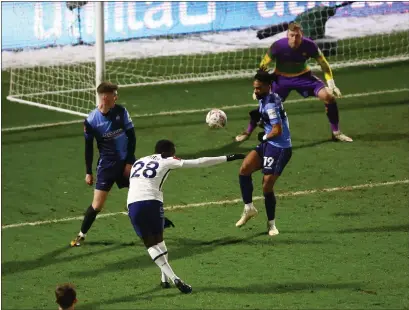  ??  ?? Tanguy Ndombele fires home Tottenham’s fourth goal of the night as they knocked out Wycombe