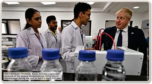  ?? ?? PARTNERSHI­P PROMISE: Boris Johnson (right) with students at the Gujarat Biotechnol­ogy University in Gandhinaga­r during his visit to India in April this year