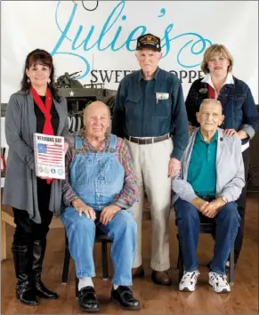  ?? PHOTOS BY NICK HILLEMANN/RIVER VALLEY & OZARK EDITION ?? From the left, Julie Goodnight, owner and organizer of Monday’s Veterans Day celebratio­n; veterans Harold Starr, Melvin Bailey and William Harry Midgett; and Tracy Tidwell of the Tracy Tidwell Team, ERA Henley Real Estate, a major supporter of Monday’s...